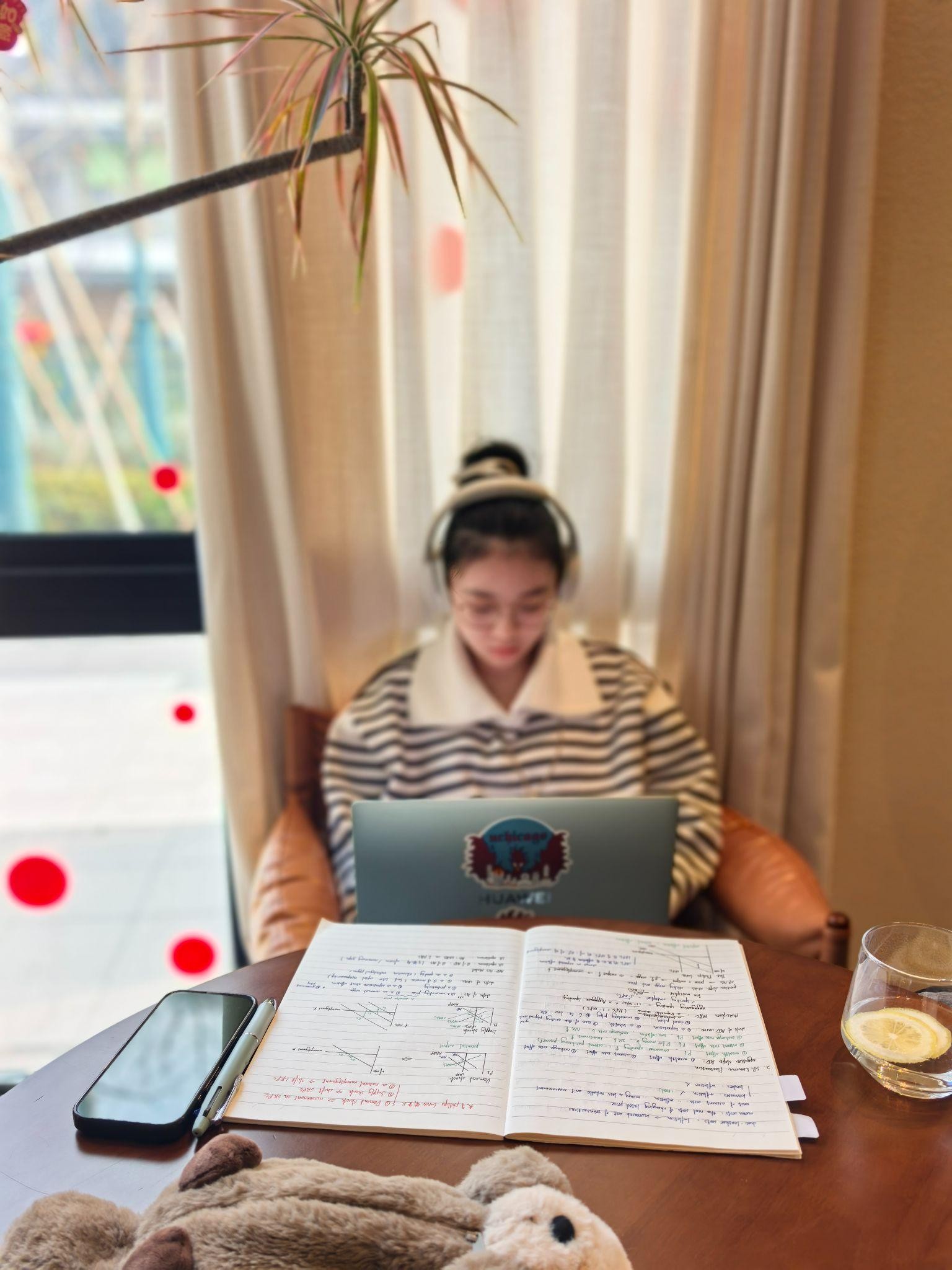 Joey writing and working at a desk